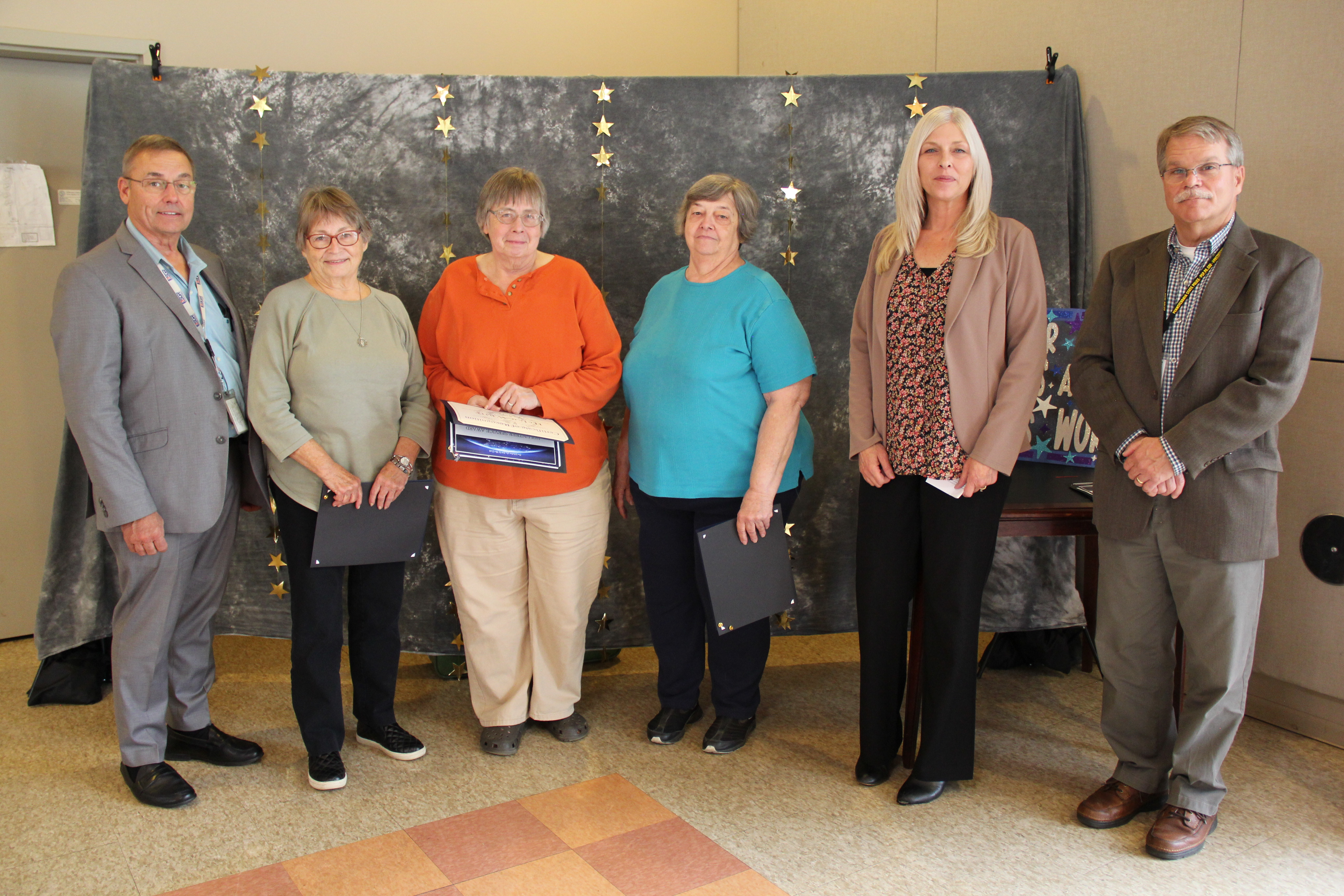 Volunteers recognized for 5 years of service were: (L to R) Arlene Milligan, Helen White, and Ethel Davis shown with Jefferson County Commissioner, Herb Bullers; Tracy Clark for Representative Brian Smith; and Commissioner Scott North.